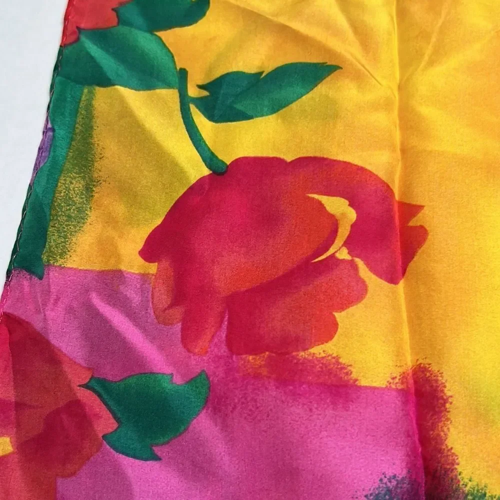 Vibrant floral silk scarf with gold purple pink and red flowers.